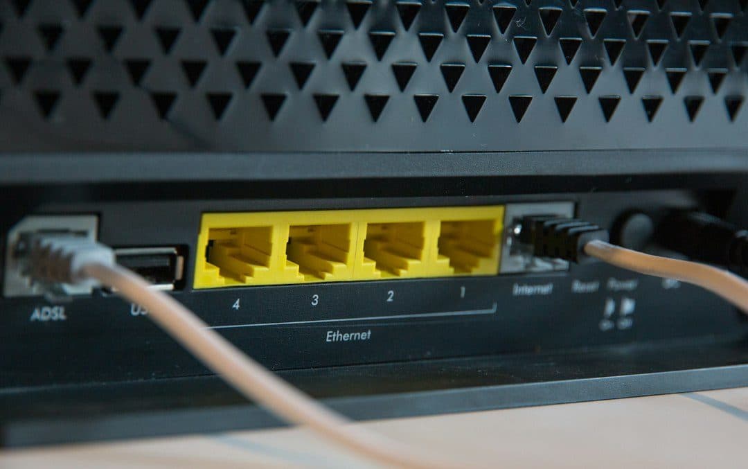 The back of a home router with Ethernet cables plugged in, the first thing to check when NEWDYTV is not working
